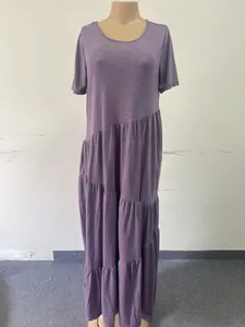 Full view of a purple short-sleeved maxi dress with an asymmetrical tiered skirt