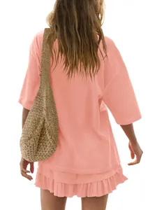 Back view detail of casual salmon pink short sleeve top and ruffled mini skirt set