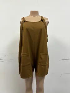 Detailed view of casual brown sleeveless strap romper with two front pockets