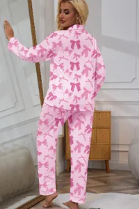 Detailed back view of pink bow print long sleeve pajama set for women in home setting