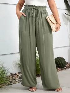 Full-length view of olive green wide-leg casual pants with elastic drawstring waist