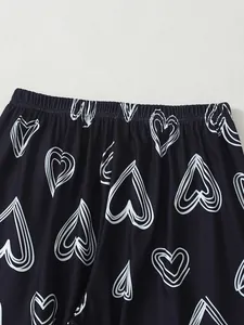 Detailed close-up view showing the elastic waistband on heart print pajama pants for women.