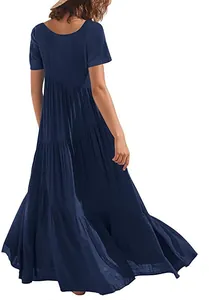 Back view of a flowing navy blue short sleeve tiered maxi dress with asymmetric layers for summer