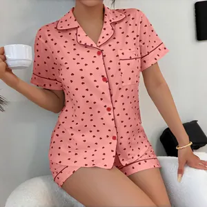 Pink heart print pajama set for women, featuring a lapel shirt and matching shorts.