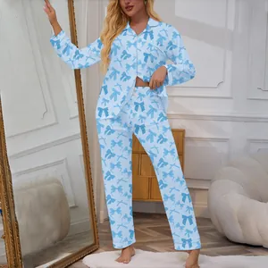 Women's light blue long sleeve pajama set featuring a stylish dark blue bow print