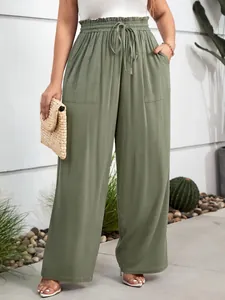 Close-up of olive green plus size wide-leg casual pants with drawstring elastic waist