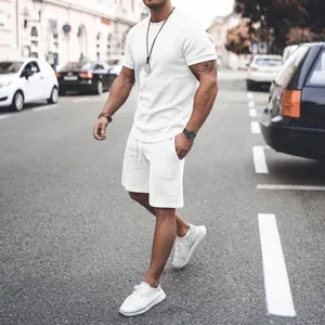 Detailed view of men's white summer casual short sleeve t-shirt and shorts set