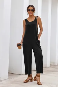 Full-length detail shot of a loose black sleeveless wide-leg jumpsuit on a model