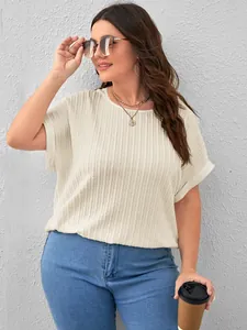 Detailed shot of a stylish plus size cream textured short sleeve T-shirt for women