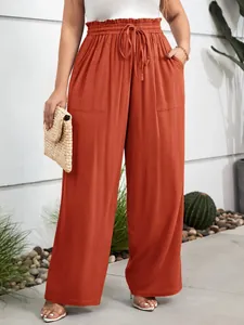 Detail view of terracotta plus size wide leg pants with elastic waist and pockets