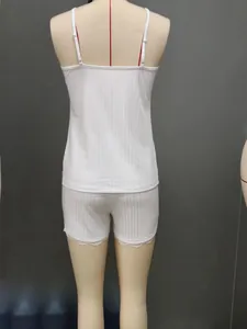 Detailed back view of white ribbed cami and shorts pajama set with delicate lace trim