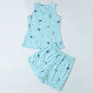 Light blue women's pajama set featuring star and moon prints with tank top and shorts.