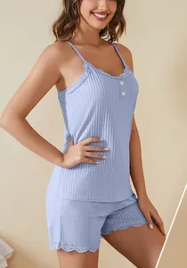Detail view of light blue ribbed pajama set with elegant lace trim and button accents