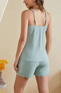 Detailed back view of a light green ribbed camisole and lace-trim shorts lounge set.