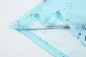High-quality detailed close-up of neat stitching on light blue star print loungewear hemline
