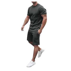 Casual men's athletic two-piece summer set with dark grey short sleeve t-shirt and shorts