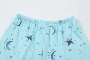 Close-up of women's pajama shorts with star moon print and soft elastic waistband