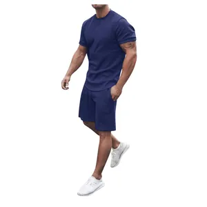 Full view of men's navy blue athletic short set on a fit model