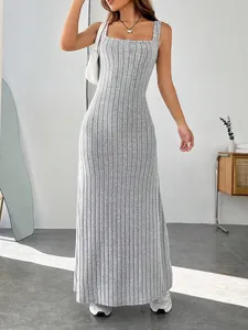 Close-up detail of a light grey ribbed slim fit maxi dress featuring a chic square neckline
