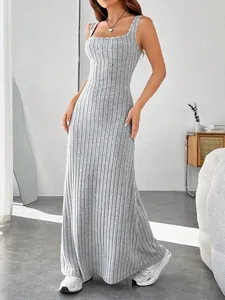 Full-length view of a grey ribbed sleeveless maxi dress in a modern slim-fit design.