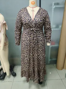 Full view of the leopard print long sleeve maxi dress displayed on a studio mannequin