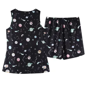 Two-piece women's pajama set with planet and star space print on black fabric