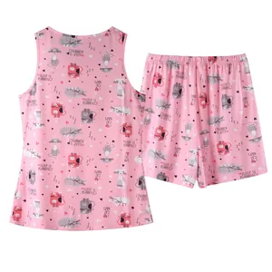 Detailed view of pink women's pajama set with cute cartoon cat pattern and text print