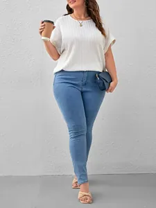 Close-up of a white plus-size textured short-sleeve T-shirt for summer fashion