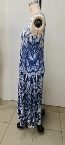 Side view of a sleeveless summer maxi dress with vintage blue and white floral print.