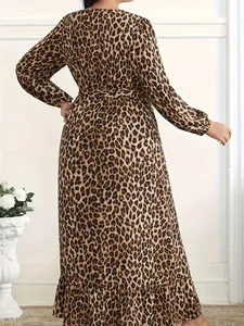Back view of a stylish leopard print long-sleeved maxi dress for women in a bright room.