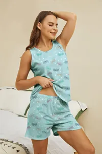 Detail view of women's light blue butterfly print pajama set with tank and shorts