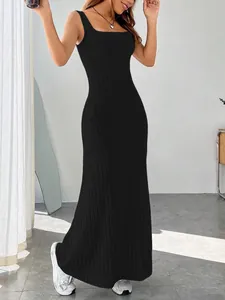 Detailed view of a black ribbed slim-fit sleeveless maxi dress with a modern square neckline
