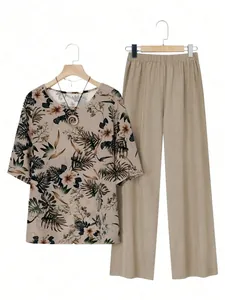 Close-up of women's floral short sleeve blouse and solid khaki trousers casual outfit set