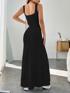 Back view of a minimalist black ribbed maxi dress with wide straps and square neckline