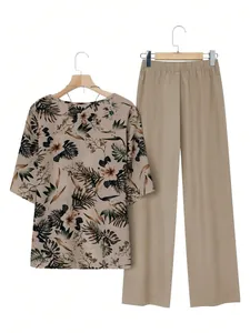 Two-piece women's leisure set featuring tropical floral print top and solid beige pants