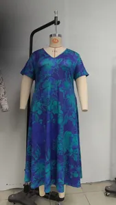 Detailed view of a plus-size blue floral maxi dress with V-neckline on mannequin
