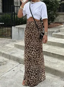 Fashionable leopard print high waisted maxi skirt for summer styled with crop top