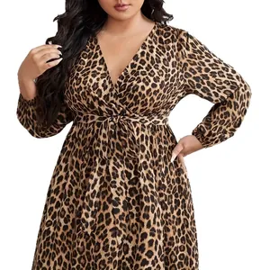 Elegant plus size leopard print long sleeve wrap dress with V-neck and waist tie.