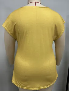 Back view detail of a casual yellow plus size T-shirt for women displayed on a mannequin