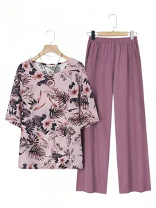 Women's two-piece lounge set with botanical print short sleeve top and purple wide leg pants