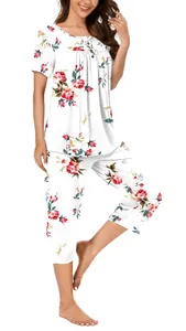 Detail of woman wearing floral print round neck pajama set with elegant button accent