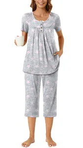 Comfortable women's two-piece pajama set with pink star prints and buttons on a white background