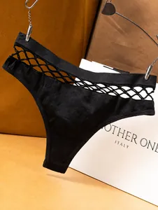 Detailed view of sexy black fishnet cutout waistband on seamless sports thong for women