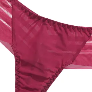 Detailed close-up view of dark pink ice silk thong underwear with mesh texture