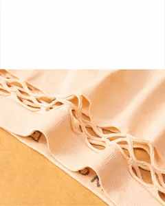 Close-up of the elastic waistband and hollow mesh design on the peach seamless thong