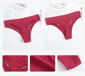 Close-up detail showing the mesh texture and cutout design of seamless red thong