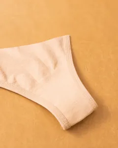 Close-up showing the breathable cotton crotch detail on a seamless thong for women.