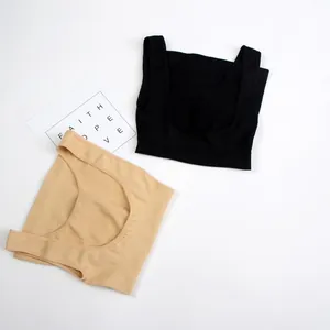 Seamless tummy control shaper vest with U-neck design in black and beige flat lay