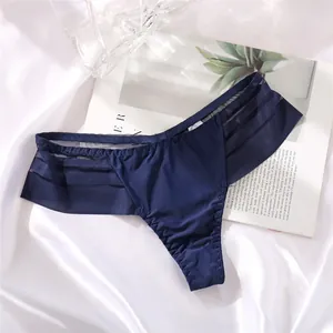 Close-up detail of navy blue low-waist ice silk thong with striped mesh side panels
