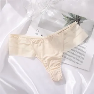 Macro detail view of beige seamless ice silk thong with elegant striped lace trim
